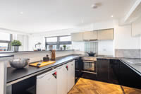 Large well equipped open plan kitchens
